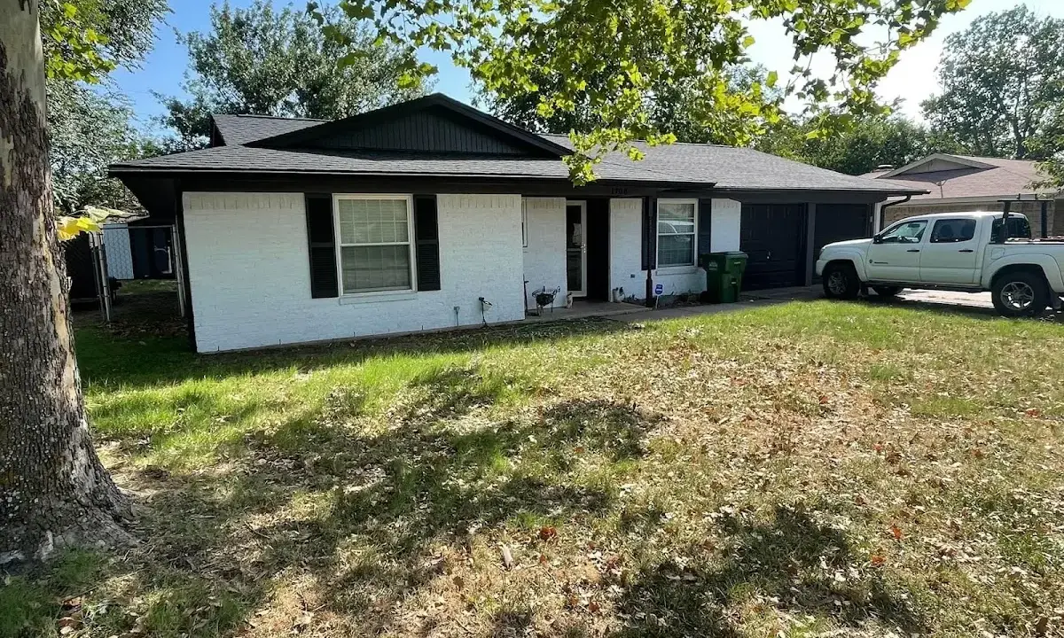 Professional roofing crew working on a residential roof in Alamo Heights